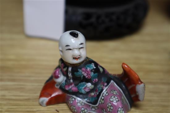 Two Chinese famille rose dishes, a figure of a boy, a porcelain brush pot and a bamboo brush pot tallest 28cm